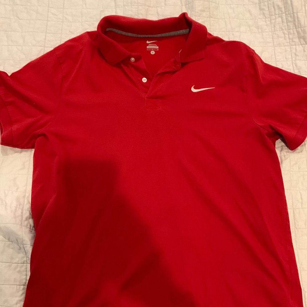 Nike Polo. 100% cotton. Size L (but fits like a medium). Like new